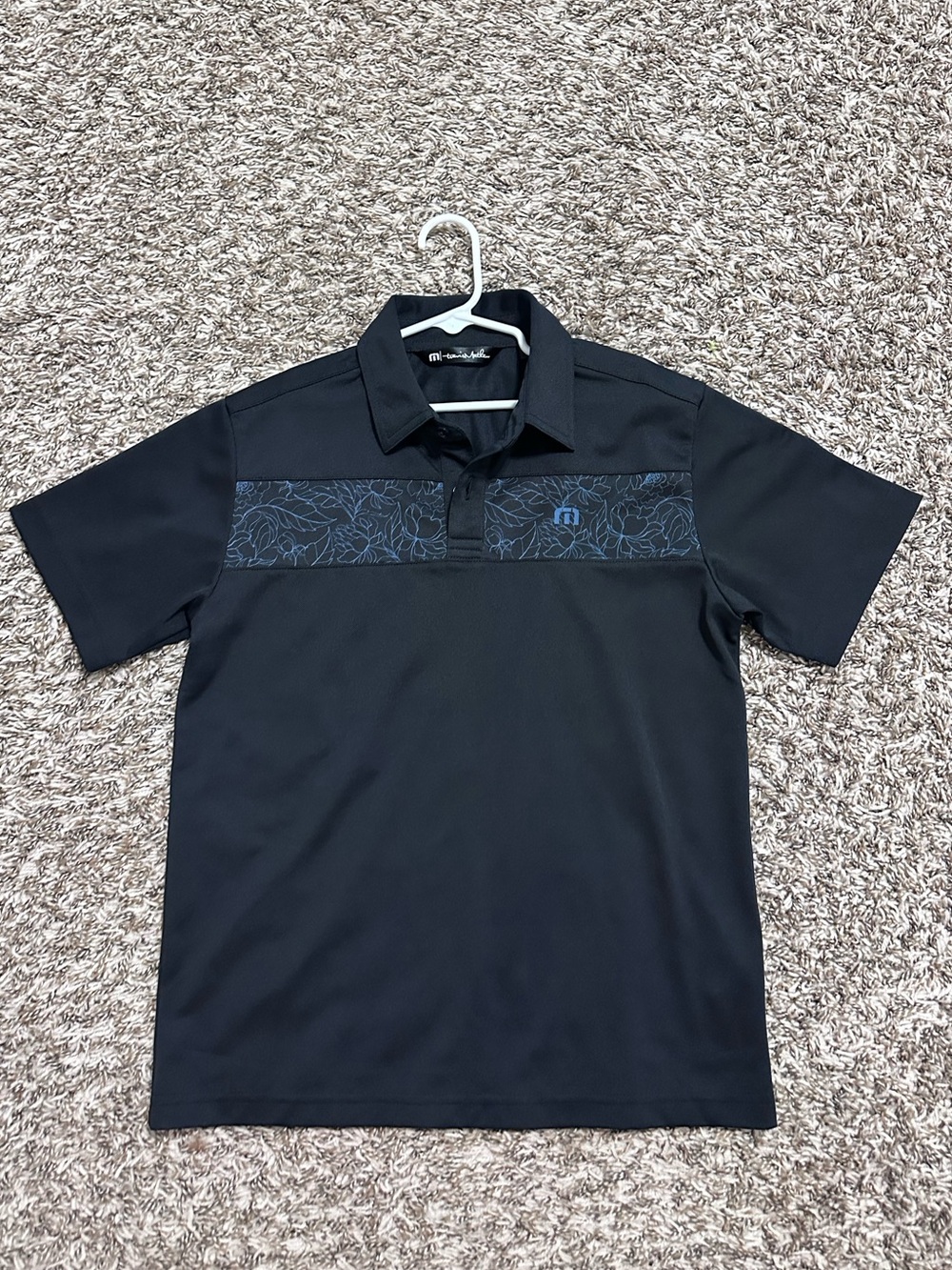 Travis Mathew boys M Black Polo with Subtle Navy Floral Chest Panel